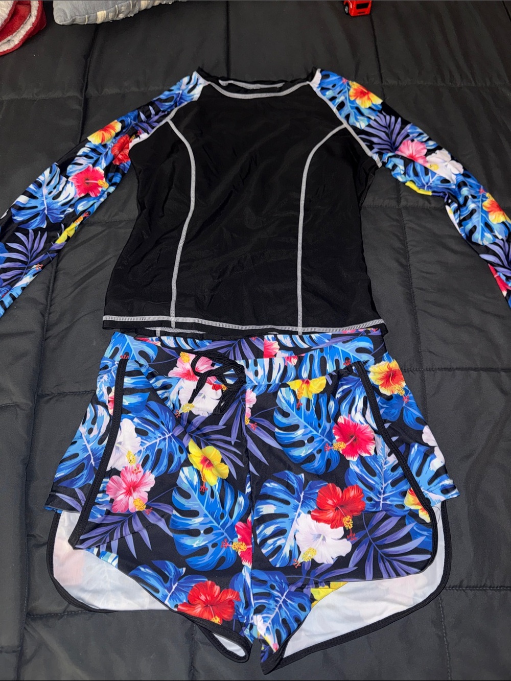 Black Rash Guard Top with Tropical Blue Floral Swim Shorts
